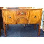 A Georgian inlaid and bow fronted mahogany sideboard fitted with two deep drawers (one a