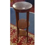 An Edwardian mahogany three tier inlaid plant stand.