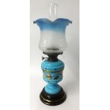Victorian oil lamp with decorated blue reservoir, height to the top of the shade 45cm.
