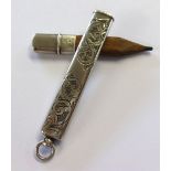 A silver cased pencil.