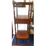 Victorian mahogany three tier what not, fitted with a drawer on brass castors, height 143cm.