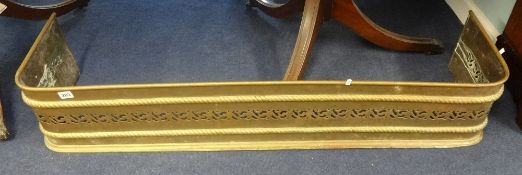 A 19th Century pierced brass fire fender, width 130cm.