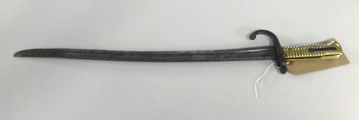 A 19th Century bayonet with brass hilt, length 63cm.