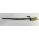 A 19th Century bayonet with brass hilt, length 63cm.