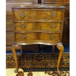 A reproduction walnut serpentine fronted three drawer chest, width 52cm.