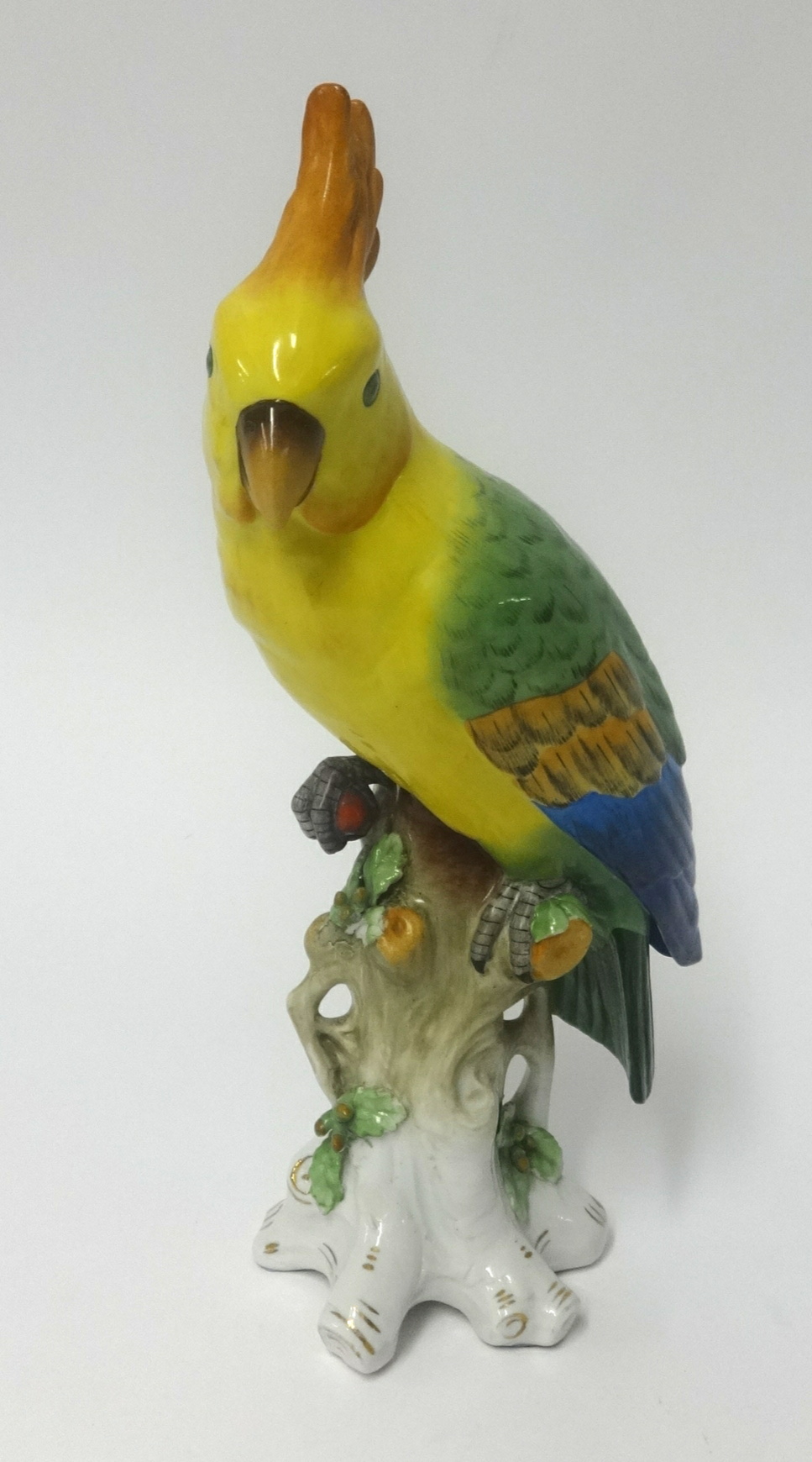 A porcelain model of a parrot with gold anchor mark, height 30cm.