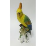 A porcelain model of a parrot with gold anchor mark, height 30cm.