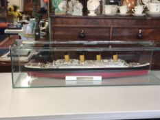 Titanic model in glass case, length 110cm.