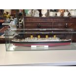 Titanic model in glass case, length 110cm.