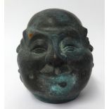 A 20th century Oriental bronze effect four face figure with character mark, height 14cm.