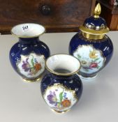 A Bavarian porcelain three piece vase group decorated with gilt work and flowers.