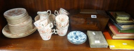 A 19th Century mahogany tea caddy, a Victorian twelve setting porcelain tea service, sundry books,