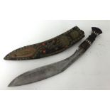 A Khukri knife with ornate jewelled scabbard.