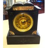 Ansonia, black marble mantel clock with eight day striking movement and key.
