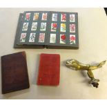 Various items including heavy dolphin brass door knocker, part album of cigarette cards, Masonic