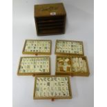 A Mahjong set, in oak case.