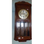 An early 20th century mahogany cased wall clock.