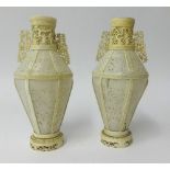 Two antique carved ivory vases.
