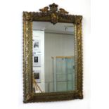 A ornate pierced brass framed mirror, overall size 70cm x 48cm.