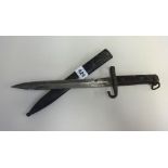 A 19th/20th century Bayonet with metal scabbard, stamped W.G, length 36cm.