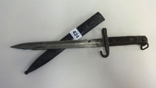 A 19th/20th century Bayonet with metal scabbard, stamped W.G, length 36cm.