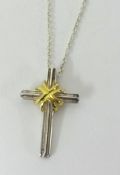 Tiffany silver and gold cross and fine chain, boxed.