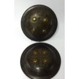 A pair of 19th/early 20th Century Indo-Persian shields, each fitted with arm supports and