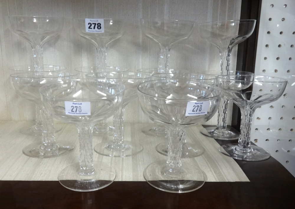 A collection of fourteen champagne glasses.