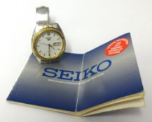 A gents Seiko gilt and stainless steel automatic wristwatch.