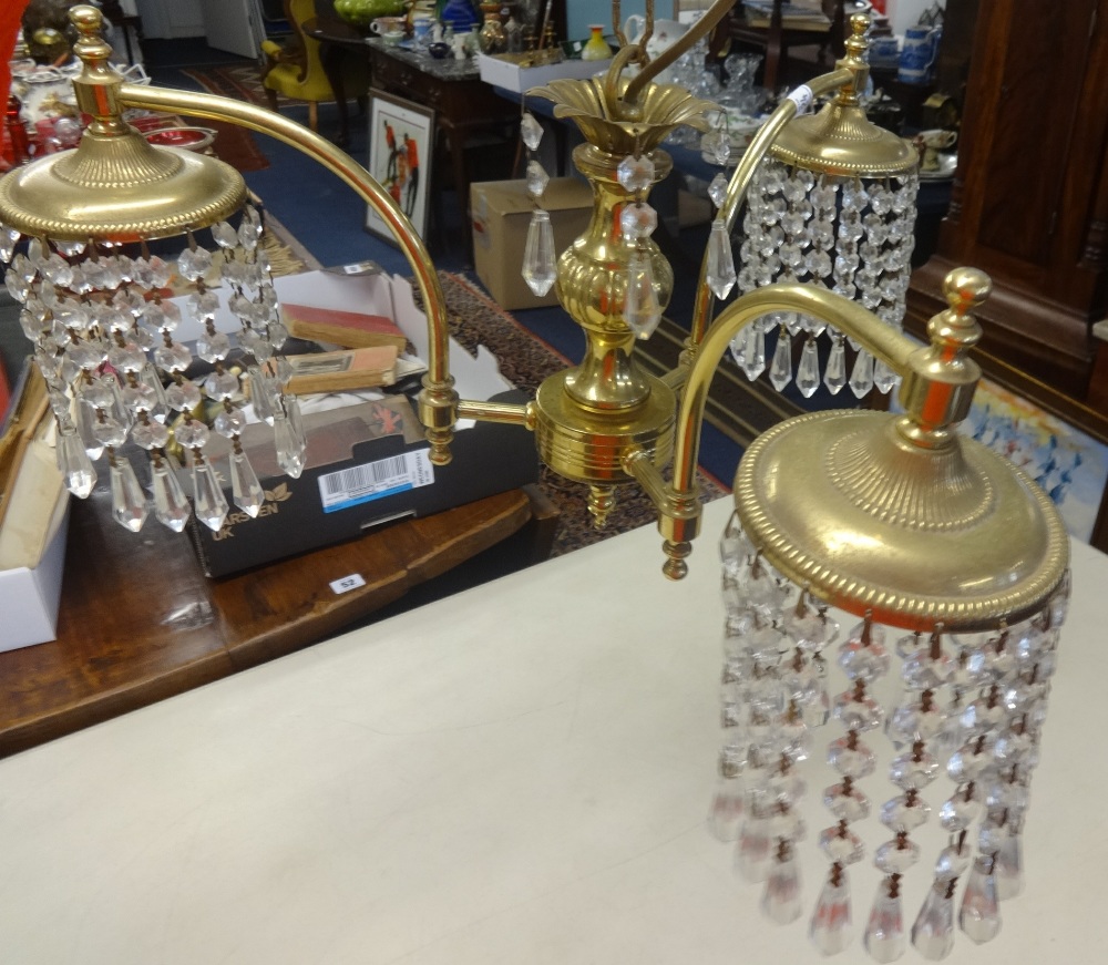 A three arm brass and cut glass chandelier together with a 1920's Bar Let typewriter.