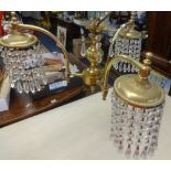 A three arm brass and cut glass chandelier together with a 1920's Bar Let typewriter.