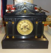 A Victorian black slate architectural mantel clock and a small reproduction Swiza bracket clock (