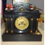 A Victorian black slate architectural mantel clock and a small reproduction Swiza bracket clock (