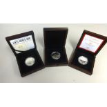 Three commemorative silver proof coins including Jersey D-Day, WWI and Prince George, boxed with