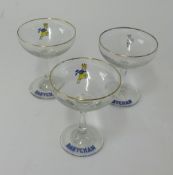 A collection of thirteen assorted Babycham glasses.