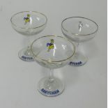 A collection of thirteen assorted Babycham glasses.