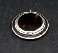 A Geo V silver and tortoiseshell mounted compact mirror, circa 1923, maker 'S & C', diameter 5cm.