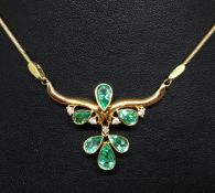 A pretty 18ct emerald and diamond necklace set in yellow gold with a 9ct gold chain.