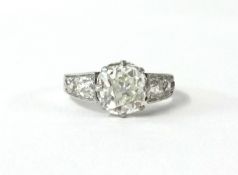 A fine diamond ring, the main stone approx 2.50ct with six further diamonds to the shoulders, set in