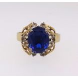 An 18ct blue and white stone ring, approx 5.8gms, together with a copy of a recent insurance