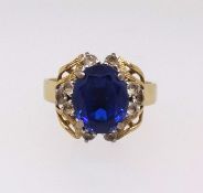 An 18ct blue and white stone ring, approx 5.8gms, together with a copy of a recent insurance