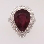 A 14k white gold and diamond ring set with a pear cut ruby approx 7.43ct, diamonds approx 0.60ct