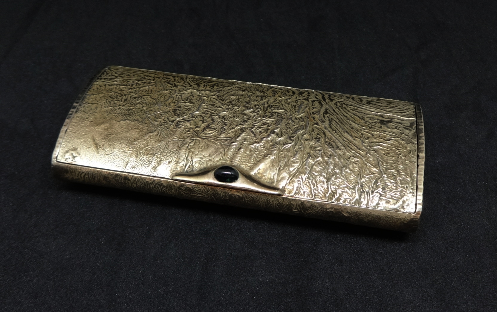 A 20th Century silver snuff box of oval form with hinged lid with textured finish gilt lined, with