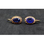 Pair of antique sapphire style and yellow metal earrings.