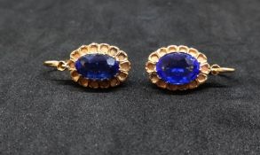 Pair of antique sapphire style and yellow metal earrings.