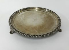 A Geo IV silver salver, with gadrooned border, diameter 24cm, circa 1829, approx 20oz.