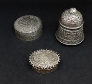 Three continental silver lidded pots with ornate chased design.