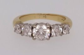 An 18ct five stone diamond ring (the centre stone approx 0.75ct), finger size O1/2.