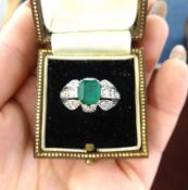 An 18ct emerald and diamond ring of Art Deco design, finger size L/M.