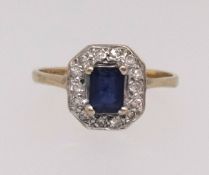 A 9ct diamond and sapphire cluster ring (AT Ltd), finger size M.